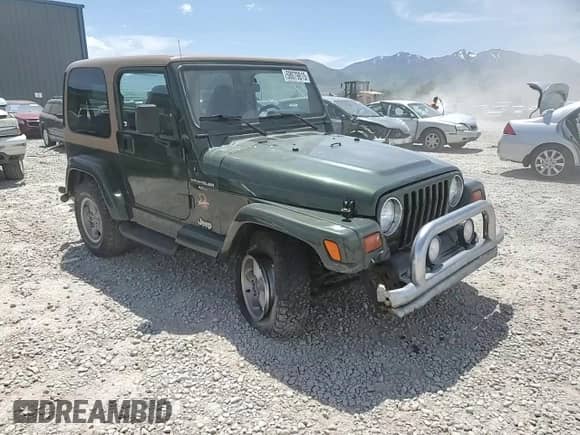 1997 Jeep Wrangler Sahara with VIN 1J4FY49S9VP452813, listed as a Copart auction lot 58079815 with 76,773 mi miles and Salvage title. Bid and sale history available at DreamBid. Image 13.