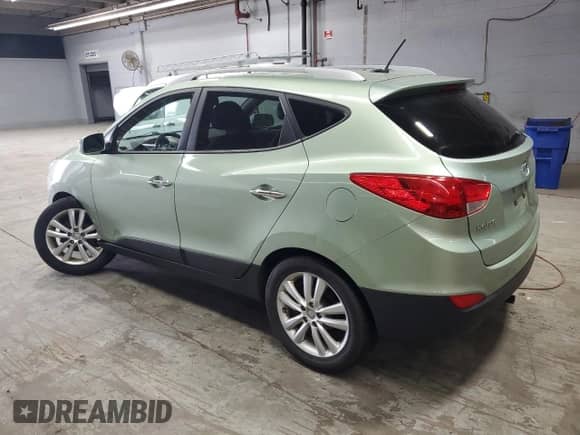 2011 Hyundai Tucson GLS with VIN KM8JU3ACXBU225908, listed as a Copart auction lot 71079005 with 114,646 mi miles and Salvage title. Bid and sale history available at DreamBid. Image 2.