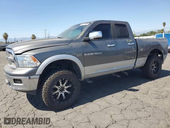 2012 Ram 1500 Laramie with VIN 1C6RD7JT9CS327557, listed as a Copart auction lot 66227085 with 203,830 mi miles and Salvage title. Bid and sale history available at DreamBid. Image 1.