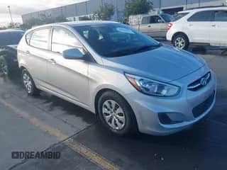 2015 Hyundai Accent GS z VIN KMHCT5AE4FU232531, wystawiony jako IAAI lot #43431337 z przebiegiem 97 078 mil mil oraz . Historia ofert i sprzedaży dostępna na DreamBid. Obrazek 1.