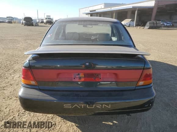 1996 Saturn SL with VIN 1G8ZK527XTZ335205, listed as a Copart auction lot 42230735 with 82,344 mi miles and Salvage title. Bid and sale history available at DreamBid. Image 6.