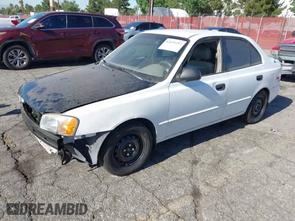 2002 Hyundai Accent GL z VIN KMHCG45C42U375352, wystawiony jako IAAI lot #42699297 z przebiegiem 103 540 mil mil oraz . Historia ofert i sprzedaży dostępna na DreamBid. Obrazek 2.