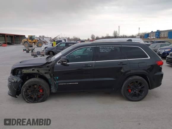 2015 Jeep Grand Cherokee SRT with VIN 1C4RJFDJXFC861770, listed as a IAAI auction lot 41698296 with 74,135 mi miles and . Bid and sale history available at DreamBid. Image 15.