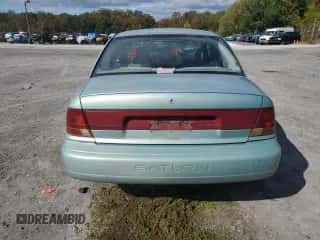 1997 Saturn SL with VIN 1G8ZK5274VZ271990, listed as a Copart auction lot 87279155 with 147,825 mi miles and Salvage title. Bid and sale history available at DreamBid. Image 6.