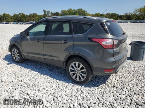 2017 Ford Escape Titanium с VIN 1FMCU9JDXHUD75370, выставлен на аукционе Copart как лот 80217015 с пробегом 145 360 миль миль и Списание • Salvage title. История ставок и продаж доступна на DreamBid. Изображение 2.