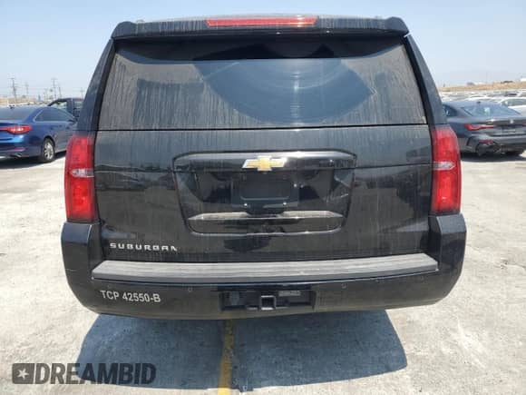 2019 Chevrolet Suburban LS with VIN 1GNSCGKC3KR231271, listed as a Copart auction lot 64438195 with 107,178 mi miles and Salvage title. Bid and sale history available at DreamBid. Image 6.
