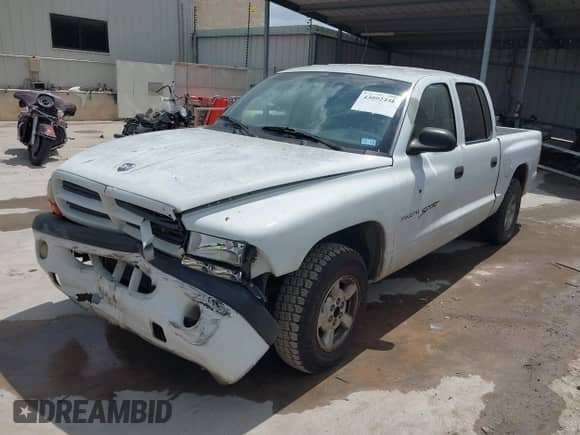 2001 Dodge Dakota Sport with VIN 1B7GL2AX11S138942, listed as a IAAI auction lot 43092446 with 258,961 mi miles and . Bid and sale history available at DreamBid. Image 2.