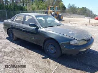 1995 Toyota Camry LE z VIN 4T1GK12E5SU860216, wystawiony jako IAAI lot #41803933 z przebiegiem 235 130 mil mil oraz . Historia ofert i sprzedaży dostępna na DreamBid. Obrazek 1.