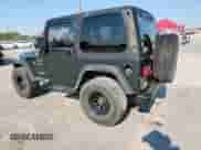 2002 Jeep Wrangler Sport with VIN 1J4FA49S82P730326, listed as a Copart auction lot 70413695 with 148,258 mi miles and Salvage title. Bid and sale history available at DreamBid. Image 2.