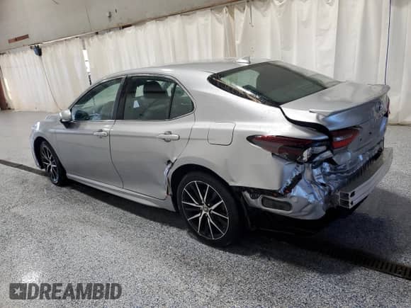 2023 Toyota Camry SE z VIN 4T1G11AK6PU818767, wystawiony jako Copart lot #86149815 z przebiegiem 45 434 mil mil oraz Czysty tytuł • Clean title. Historia ofert i sprzedaży dostępna na DreamBid. Obrazek 2.