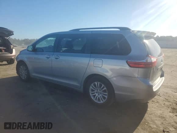 2016 Toyota Sienna XLE with VIN 5TDYK3DCXGS748698, listed as a Copart auction lot 84625385 with 93,932 mi miles and Salvage title. Bid and sale history available at DreamBid. Image 2.