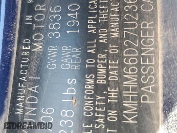 2007 Hyundai Tiburon GS z VIN KMHHM66D27U236507, wystawiony jako Copart lot #41334155 z przebiegiem 97 162 mil mil oraz Szkoda całkowita • Salvage title. Historia ofert i sprzedaży dostępna na DreamBid. Obrazek 14.