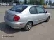 2005 Hyundai Accent GLS z VIN KMHCG35C65U332999, wystawiony jako IAAI lot #42097932 z przebiegiem 225 593 mil mil oraz . Historia ofert i sprzedaży dostępna na DreamBid. Obrazek 4.