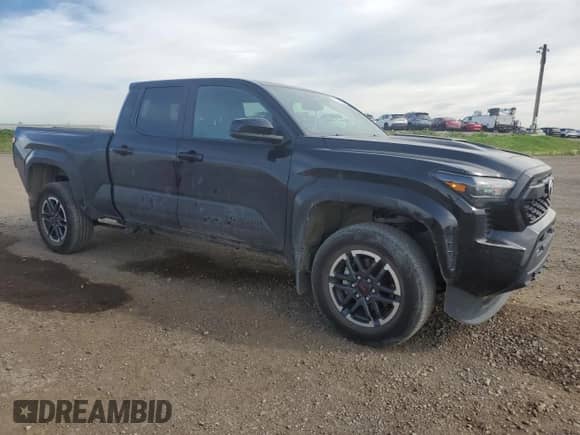 2024 Toyota Tacoma SR5 with VIN 3TYLB5JN2RT055045, listed as a Copart auction lot 69134065 with 25,584 mi miles and Salvage title. Bid and sale history available at DreamBid. Image 4.