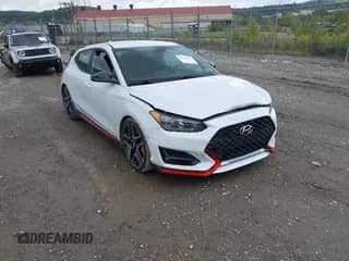 2012 Hyundai Veloster w/Gray Int z VIN KMHTC6ADXCU077475, wystawiony jako IAAI lot #43316883 z przebiegiem 123 014 mil mil oraz . Historia ofert i sprzedaży dostępna na DreamBid. Obrazek 1.