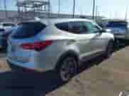 2016 Hyundai Santa Fe with VIN 5XYZT3LB6GG334051, listed as a IAAI auction lot 43110895 with 129,029 mi miles and . Bid and sale history available at DreamBid. Image 4.
