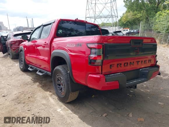 2025 Nissan Frontier Pro-4X with VIN 1N6ED1EK2SN612245, listed as a IAAI auction lot 43065097 with 1,878 mi miles and . Bid and sale history available at DreamBid. Image 3.
