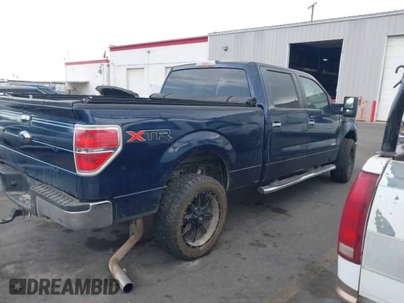2014 Ford F-150 FX4 with VIN 1FTFW1ET9EKF58099, listed as a IAAI auction lot 42827623 with Not provided miles and . Bid and sale history available at DreamBid. Image 3.