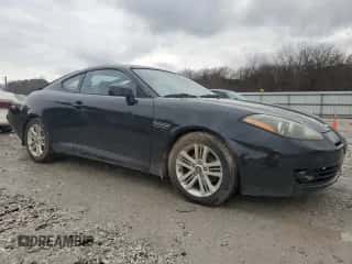 2007 Hyundai Tiburon GS с VIN KMHHM66D17U248440, выставлен на аукционе Copart как лот 86642384 с пробегом 125 156 миль миль и Чистый • Clean title. История ставок и продаж доступна на DreamBid. Изображение 4.