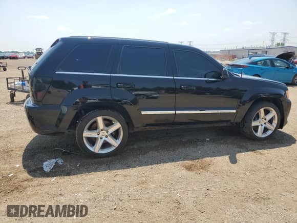 2008 Jeep Grand Cherokee SRT-8 with VIN 1J8HR78398C101363, listed as a Copart auction lot 63618635 with 124,501 mi miles and Salvage title. Bid and sale history available at DreamBid. Image 3.