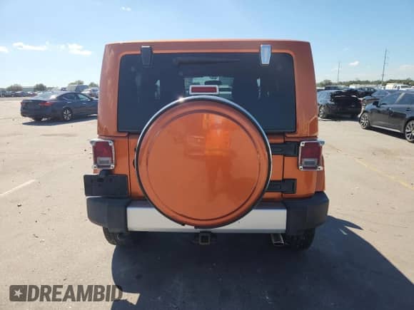 2011 Jeep Wrangler Sahara с VIN 1J4GA5D18BL576541, выставлен на аукционе Copart как лот 87415305 с пробегом 142 246 миль миль и Списание • Salvage title. История ставок и продаж доступна на DreamBid. Изображение 6.