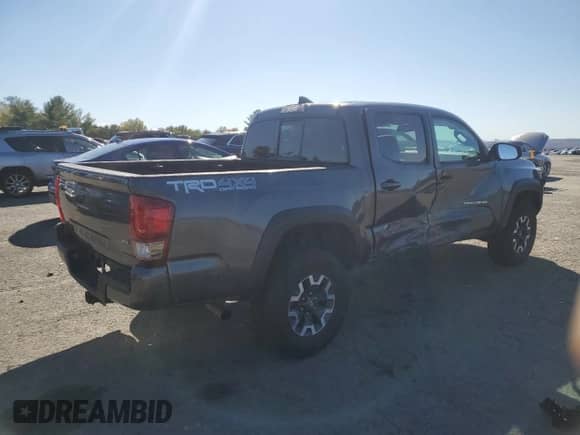 2016 Toyota Tacoma TRD Off Road with VIN 3TMCZ5AN2GM006271, listed as a Copart auction lot 87053715 with 92,101 mi miles and Salvage title. Bid and sale history available at DreamBid. Image 3.