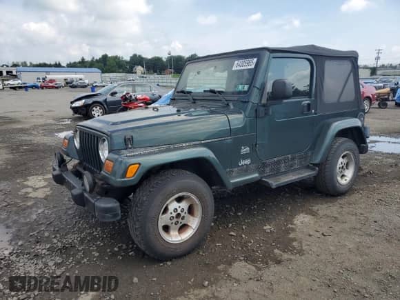 2003 Jeep Wrangler Sahara с VIN 1J4FA59S73P308250, выставлен на аукционе Copart как лот 64305965 с пробегом 186 288 миль миль и Чистый • Clean title. История ставок и продаж доступна на DreamBid. Изображение 1.