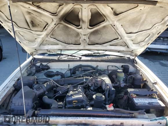 1995 Toyota Tacoma z VIN 4TAUN53B5SZ002480, wystawiony jako Copart lot #71305825 z przebiegiem 467 592 mil mil oraz Szkoda całkowita • Salvage title. Historia ofert i sprzedaży dostępna na DreamBid. Obrazek 11.