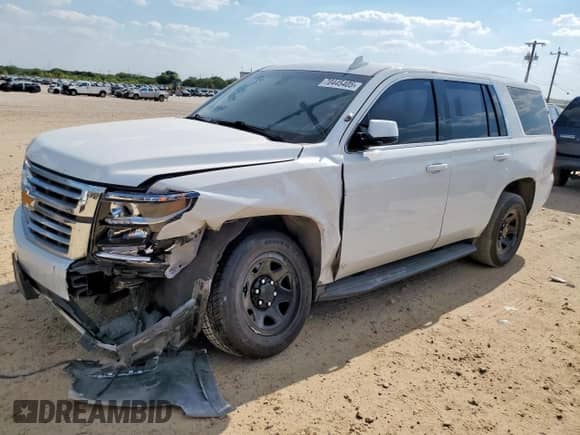 2020 Chevrolet Tahoe Commercial z VIN 1GNLCDECXLR246415, wystawiony jako Copart lot #70445405 z przebiegiem 65 230 mil mil oraz Czysty tytuł • Clean title. Historia ofert i sprzedaży dostępna na DreamBid. Obrazek 1.