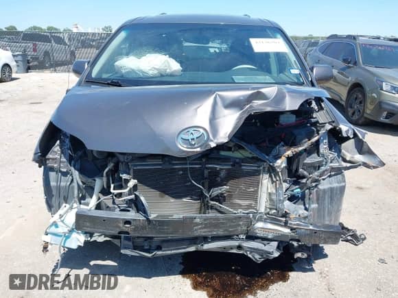 2012 Toyota Sienna SE with VIN 5TDXK3DC5CS232979, listed as a IAAI auction lot 43136504 with 198,231 mi miles and . Bid and sale history available at DreamBid. Image 6.