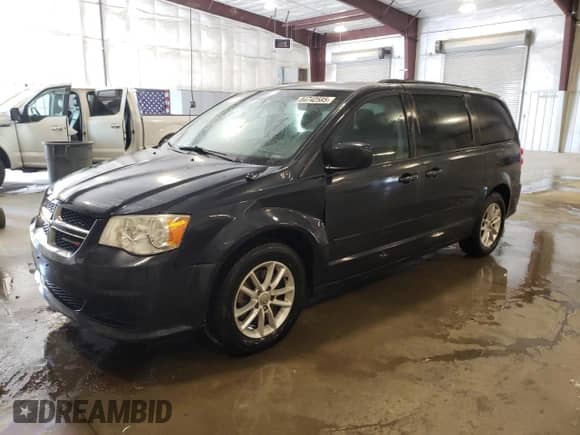 2014 Dodge Grand Caravan SXT with VIN 2C4RDGCG9ER203169, listed as a Copart auction lot 84742585 with 84,163 mi miles and Salvage title. Bid and sale history available at DreamBid. Image 1.