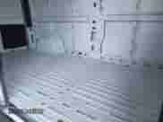 2023 Ram ProMaster Cargo z VIN 3C6LRVDG1PE563915, wystawiony jako IAAI lot #43157899 z przebiegiem 60 680 mil mil oraz . Historia ofert i sprzedaży dostępna na DreamBid. Obrazek 8.