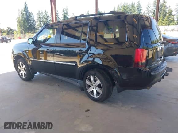 2012 Honda Pilot Touring with VIN 5FNYF4H99CB075099, listed as a IAAI auction lot 42674383 with 203,684 mi miles and . Bid and sale history available at DreamBid. Image 3.