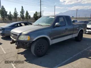 2003 Ford F-150 XL with VIN 2FTRX17W33CA50889, listed as a Copart auction lot 70733225 with 159,605 mi miles and Salvage title. Bid and sale history available at DreamBid. Image 1.