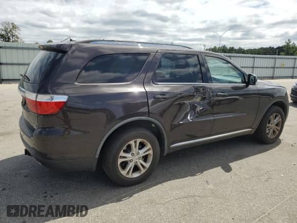 2012 Dodge Durango Crew with VIN 1C4RDHDG4CC284902, listed as a Copart auction lot 67820865 with 202,125 mi miles and Salvage title. Bid and sale history available at DreamBid. Image 3.