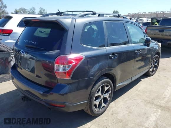 2014 Subaru Forester XT Premium with VIN JF2SJGDC0EH520728, listed as a IAAI auction lot 43336202 with 165,577 mi miles and . Bid and sale history available at DreamBid. Image 4.