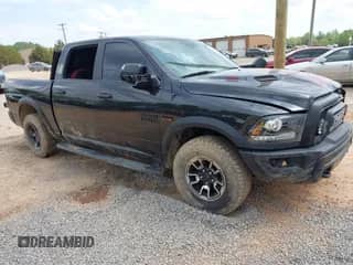 2018 Ram 1500 Rebel z VIN 1C6RR7YT4JS151036, wystawiony jako IAAI lot #41988370 z przebiegiem 72 587 mil mil oraz . Historia ofert i sprzedaży dostępna na DreamBid. Obrazek 1.