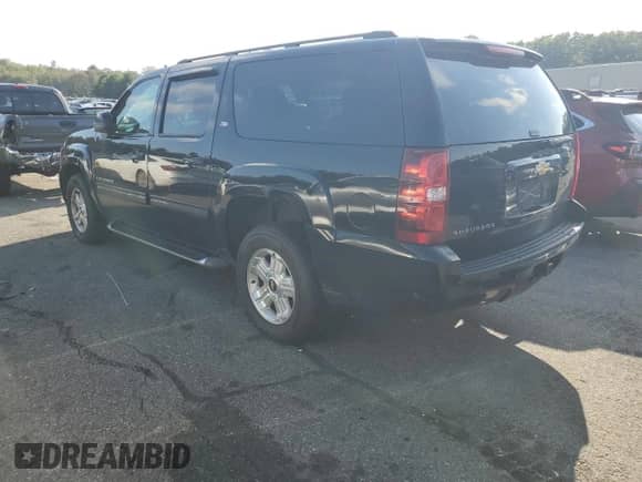 2014 Chevrolet Suburban LT with VIN 1GNSKJE71ER210650, listed as a Copart auction lot 71705935 with 207,810 mi miles and Salvage title. Bid and sale history available at DreamBid. Image 2.