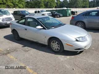 2002 Saturn SC with VIN 1G8ZP12822Z213701, listed as a Copart auction lot 68929934 with 314,042 mi miles and Salvage title. Bid and sale history available at DreamBid. Image 4.