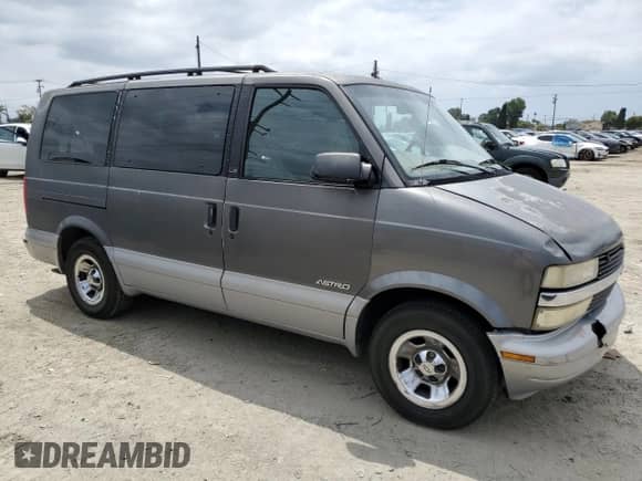 1999 Chevrolet Astro z VIN 1GNDM19WXXB114838, wystawiony jako Copart lot #55070715 z przebiegiem Nie podano mil oraz Szkoda całkowita • Salvage title. Historia ofert i sprzedaży dostępna na DreamBid. Obrazek 4.