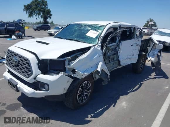 2020 Toyota Tacoma SR5 with VIN 5TFAZ5CN3LX093798, listed as a IAAI auction lot 42212050 with 85,632 mi miles and . Bid and sale history available at DreamBid. Image 18.