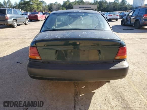 1997 Saturn SL with VIN 1G8ZH5281VZ133993, listed as a Copart auction lot 87155774 with 135,932 mi miles and Salvage title. Bid and sale history available at DreamBid. Image 6.