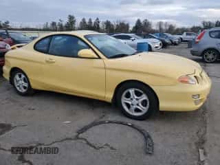 2001 Hyundai Tiburon с VIN KMHJG35F01U231789, выставлен на аукционе Copart как лот 88988265 с пробегом 106 946 миль миль и Чистый • Clean title. История ставок и продаж доступна на DreamBid. Изображение 4.