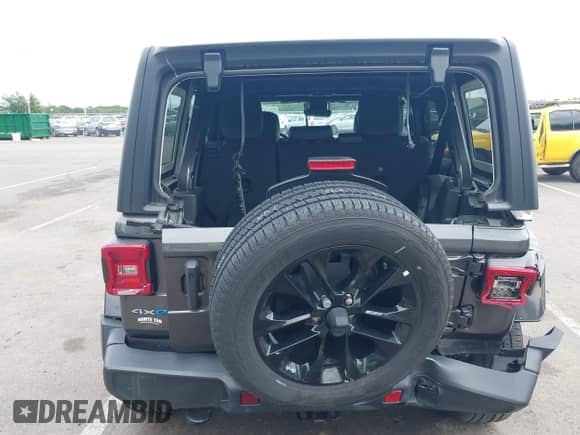 2021 Jeep Wrangler Unlimited Sahara with VIN 1C4JJXP69MW803235, listed as a IAAI auction lot 43022114 with 26,390 mi miles and . Bid and sale history available at DreamBid. Image 6.