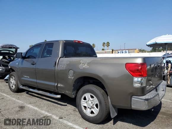 2008 Toyota Tundra with VIN 5TFRT54118X026883, listed as a Copart auction lot 82267115 with 291,654 mi miles and Salvage title. Bid and sale history available at DreamBid. Image 2.