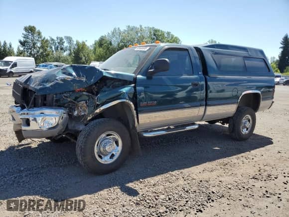 1998 Dodge RAM with VIN 3B7KF26D9WM220885, listed as a Copart auction lot 63468695 with 102,002 mi miles and Salvage title. Bid and sale history available at DreamBid. Image 1.
