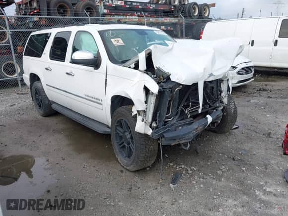 2009 Chevrolet Suburban LTZ z VIN 1GNFK36359R256609, wystawiony jako IAAI lot #42799458 z przebiegiem 146 257 mil mil oraz . Historia ofert i sprzedaży dostępna na DreamBid. Obrazek 1.