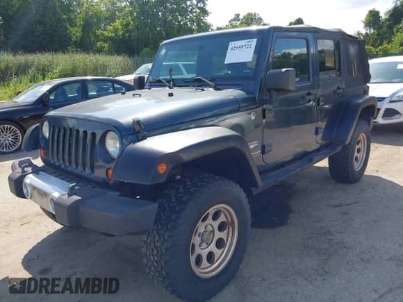2008 Jeep Wrangler Unlimited Sahara with VIN 1J4GA59128L607591, listed as a IAAI auction lot 42959722 with 129,564 mi miles and . Bid and sale history available at DreamBid. Image 17.
