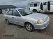 2000 Hyundai Accent with VIN KMHCG45G8YU120795, listed as a Copart auction lot 61005175 with 96,515 mi miles and Clean title. Bid and sale history available at DreamBid. Image 4.