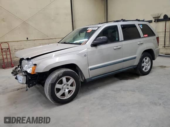 2009 Jeep Grand Cherokee Laredo with VIN 1J8GS48K19C507693, listed as a Copart auction lot 62155915 with 193,382 mi miles and Salvage title. Bid and sale history available at DreamBid. Image 1.